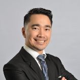 Photo of John Sam, Senior Partner