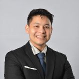 Photo of John Sam, Senior Partner