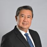 Photo of John Sam, Senior Partner
