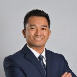 Photo of John Sam, Senior Partner